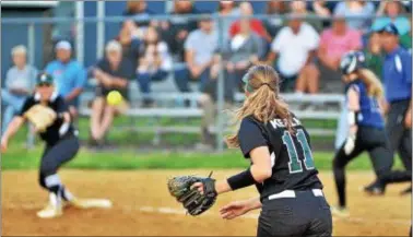  ?? KYLE FRANKO — TRENTONIAN PHOTO ?? Steinert third baseman Heather Kerlin (11) throws the ball to first base to try and record an out against WW-P North in a MCT semifinal at Armstrong Park on Monday night. The final between the Spartans and Robbinsvil­le has been postponed due to rain.