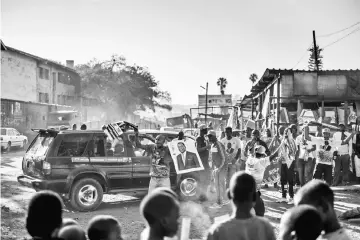  ?? — AFP photo ?? File photo shows supporters of Mnangagwa celebrate in Mbare, Harare.