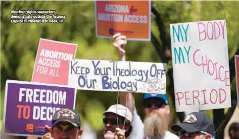  ?? AP ?? Abortion-rights supporters demonstrat­e outside the Arizona Capitol in Phoenix last week.