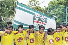  ??  ?? The young refugees who make up the Rohingya Football Club pose for a photo before a match in Kuala Lumpur.