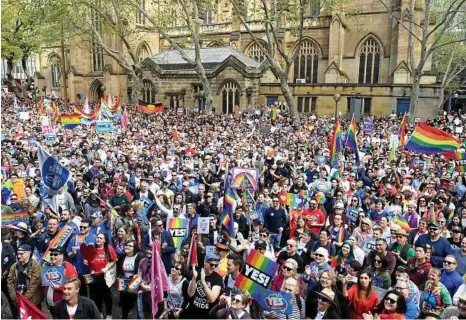  ?? PHOTO: PAUL MILLER/AAP ?? ENGAGING IN FREE SPEECH: Supporters back marriage equality at a rally in Sydney on Sunday.