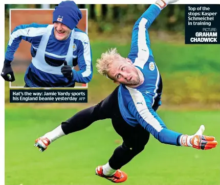  ??  ?? Hat’s the way: Jamie Vardy sports his England beanie yesterday Top of the stops: Kasper Schmeichel in training PICTURE: GRAHAM CHADWICK