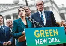  ?? Pete Marovich / New York Times ?? Rep. Alexandria Ocasio-Cortez, D-N.Y., speaks alongside Sen. Ed Markey, D-Mass., at a Washington news conference about the Green New Deal proposal.