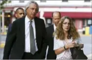  ?? THE ASSOCIATED PRESS ?? Attorney Tom Kline, left, walks with the parents of Timothy Piazza, Jim and Evelyn Piazza, toward the courthouse before a preliminar­y hearing resumes for members of a fraternity facing criminal charges over the death of their son, at the Centre County...