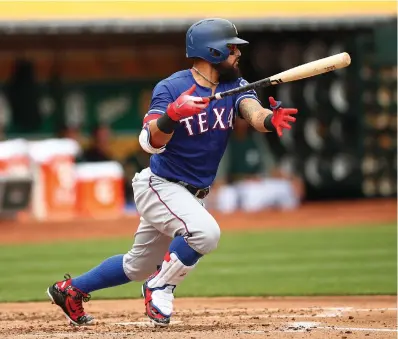  ?? Associated Press ?? ■ Texas Rangers' Rougned Odor drops his bat after hitting an RBI-single off Oakland Athletics' Daniel Mengden during the second inning of a baseball game Thursday in Oakland, Calif.