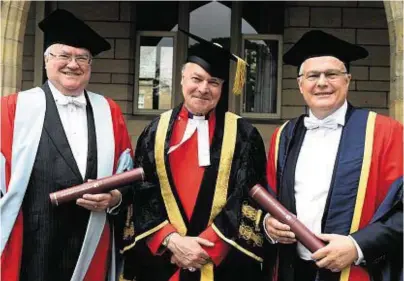  ??  ?? HONOURED: Donald Lamont, left, and David Strachan, right, with their honorary degrees with Pro-Chancellor Iain Torrance, centre, at Aberdeen University’s graduation ceremony at King’s College