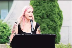  ?? Hearst Connecticu­t Media file photo ?? Katie Coelho speaks about her husband, probation officer Jonathan Coelho, during a Memorial service outside the Superior Courthouse in Stamford on July 15.