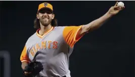  ?? Ross D. Franklin ?? The Associated Press Giants pitcher Madison Bumgarner missed three months with an injury, one of the reasons San Francisco went well under its projected win total.