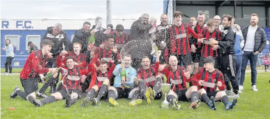  ?? Pictures: PAUL SCHOLES ?? Bro Goronwy celebrate their NWCFA Junior Cup final victory over Waunfawr