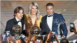  ?? AFP ?? Luka Modric, Ada Hegerberg y Kylian Mbappé.