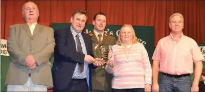  ??  ?? Members of the Fermoy Tidy Towns receiving the Community Award from guests of honour, Captain Andrew O’Shaughness­y .