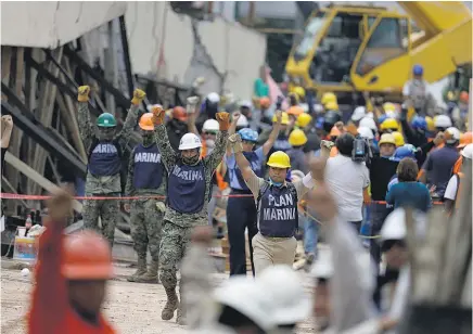  ?? Picture / AP ?? Soldiers call for silence so rescuers can listen for any signs of life at the Enrique Rebsamen primary school in Mexico City.