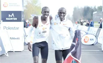  ?? - AFP photo ?? Second-placed Kenya's Jonathan Korir (left) and winner Kenya's Eliud Kipchoge celebrate during the NN Mission Marathon at Twente Airport, near Enschede, on Sunday.