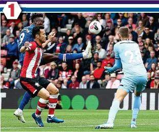  ??  ?? Leg-up: Abraham lifts the ball over Gunn for the opening goal before Mount sidefoots home to double Chelsea’s lead