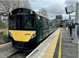  ?? Andy Coward ?? 230001 Viva Venturer stands on Platform 5 at West Ealing following its demonstrat­ion trip for invited guests on March 15, with the train recharging its batteries from the charging rails situated beneath the train.