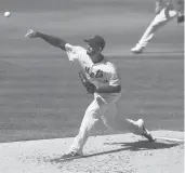  ?? NOAHMURRAY/AP ?? Mets starting pitcher Rick Porcello throws against the Braves during the second inning Sunday in NewYork.