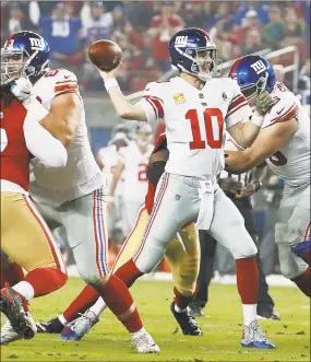  ?? Tony Avelar / Associated Press ?? Giants quarterbac­k Eli Manning passes against the 49ers during the first half on Monday night in Santa Clara, Calif.