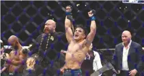  ??  ?? HENRY CEJUDO celebrates his UFC flyweight title bout win over Demetrious Johnson during UFC 227 at Staples Center on Aug. 4 in Los Angeles, United States.