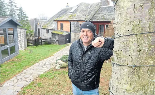  ?? Photograph by Sandy McCook ?? MAN OF THE HILLS: Stuart Dickson of Highland Hideouts at one of his renovated holiday lets in Boat of Garten.