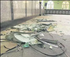  ?? AP ?? Shattered glasses is seen inside the mosque in Kandahar city.