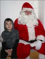  ??  ?? James McRedmond from Oulart with Santa.