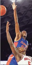  ?? Athens Banner-herald via AP - Joshua L. Jones ?? Florida’s Scottie Lewis (top) blocks a shot from Georgia’s Anthony Edwards during Wednesday night’s game in Athens.