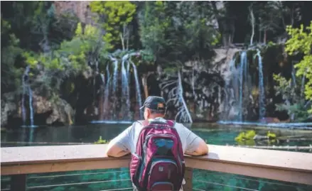  ?? Gabriel Scarlett, The Denver Post ?? Total visitation to Hanging Lake jumped to 150,000 in 2016 from 99,000 in 2014. On peak days, more than 1,100 people make the steep, 1.2-mile hike up from Glenwood Canyon to the tantalizin­g, travertine lake.