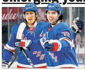  ?? Getty Images ?? GETTING HIS FIL’: Filip Chytil (right), who has a goal in five straight games, celebrates with Marc Staal after scoring in the first period.