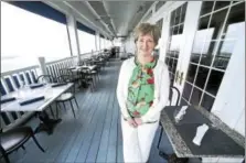  ?? (ARNOLD GOLD-NEW HAVEN REGISTER) ?? Beth McDevitt, restaurant manager of The Wharf, is photograph­ed on the back deck of the Madison Beach Hotel outside The Wharf Restaurant.
