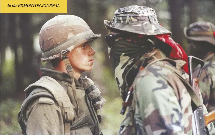 ?? The Canadian press/shaney Komulainen ?? Pte. Patrick Cloutier and Brad Larocque stand off in Oka, Que., in 1990. A Quebec developer says he’s agreed to return land that was central to the Oka Crisis 29 years ago.
