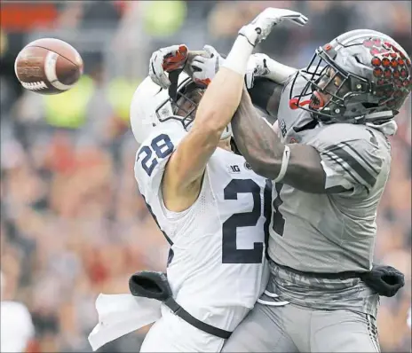  ?? Jay LaPrete/Associated Press ?? Penn State safety Troy Apke, left, breaks up a pass intended for Ohio State receiver Johnnie Dixon in the Nittany Lions’ 3938 loss last weekend in Columbus.