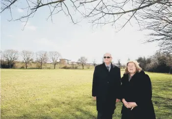  ??  ?? Cllr John Holdich and Cllr Lynne Ayres at the site of the proposed new university campus in Bishops’s Road