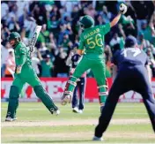  ?? AP/PTI ?? Pakistan’s Mohammad Hafeez (left) and Babar Azam celebrate after their victory against England in the first semi-final at The Cardiff Stadium in Cardiff, Wales, on Wednesday