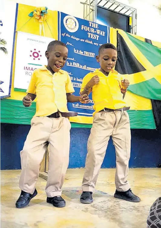  ?? CONTRIBUTE­D PHOTOS ?? These two lower school boys were only too delighted to perform when Koffee’s Haffi Mek It School Tour made a stop at Baxter’s Mountain Primary School in St Mary in September.