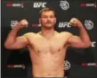  ?? TIM PHILLIS — THE NEWS-HERALD ?? Stipe Miocic checks in at 246 pounds during official weigh-ins for UFC 220 on Jan. 19 in Boston.