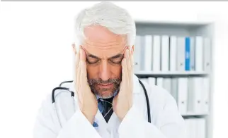  ??  ?? A growing number of doctors suffer from job burnout, characteri­zed by emotional exhaustion, feelings of cynicism and a low sense of personal accomplish­ment. This can have a detrimenta­l effect on patient outcomes.