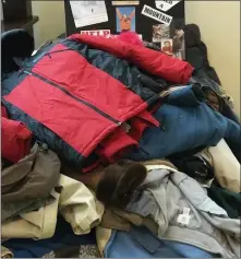  ?? COURTESY OF THE HERITAGE OF GREEN HILLS ?? Heritage of Green Hills residents built a “Mountain of Help” by donating 145coats to Opportunit­y House for World Kindness Day.
