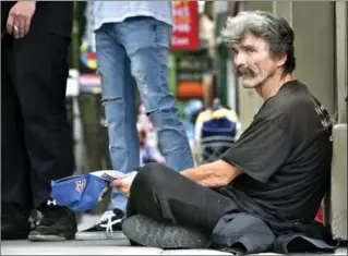  ?? JOHN RENNISON, THE HAMILTON SPECTATOR ?? Panhandler Dwight Perry is being summoned to court to deal with fines he cannot pay. Tickets carry a fine of up to $1,000 or imprisonme­nt after an initial conviction. Perry is joining a constituti­onal challenge over the matter.