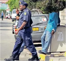  ?? PICTURE: TRACEY ADAMS ?? LAW AND ORDER: Police continue to maintain a strong presence in Masiphumel­ele after three vigilante killings.