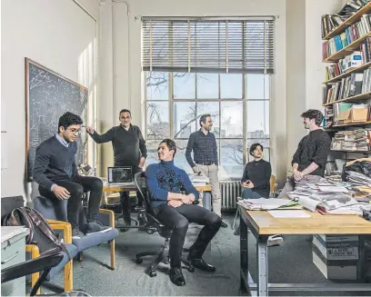  ?? Cody O’Loughlin, © The New York Times Co. ?? Members of the team developing an app called Carbin, from left, Meshkat Botshekan, Professor Franz-Josef Ulm, Jacob Roxon, Mazdak Tootkaboni, Arghavan Louhghalam and Andrew Logan, meet at the Massachuse­tts Institute of Technology in Cambridge, Mass., in January.