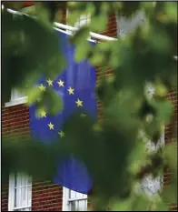  ?? ASSOCIATED PRESS ?? The EU flag hangs from Europa House Tuesday. in London,
