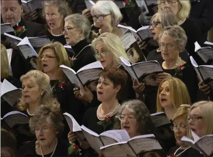  ??  ?? Choir members singing Invictus.