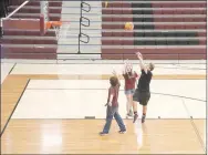  ?? LYNN KUTTER ENTERPRISE-LEADER ?? These Lincoln High students play a game of pickup basketball during their free time on Mentor Fridays.