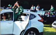  ?? Peter Hvizdak / Hearst Connecticu­t Media file photo ?? Senior Rose McDermott of the Guilford High Class of 2020 listens to graduation speakers while in a car at the Guilford Fairground­s.