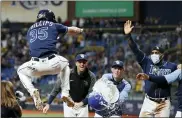  ?? SCOTT AUDETTE — THE ASSOCIATED PRESS ?? Tampa Bay Rays’ Brett Phillips (35) celebrates with teammates after hitting a three-run home run against the Detroit Tigers during the 10th inning of a baseball game Friday in St. Petersburg, Fla.