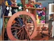  ?? PAUL POST — PPOST@DIGITALFIR­STMEDIA.COM ?? A spinning wheel, surrounded by colorful yarn, is the focal point of Carole Foster’s farm-based shop in Northumber­land.