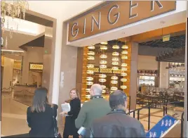  ??  ?? Media representa­tives check out the Pan-Asian restaurant, Ginger, as MGM Resorts Internatio­nal Public Relations Manager Suzie Rugh leads a tour into a retail corridor called “The District.” Guests will find actress Sarah Jessica Parker’s first...