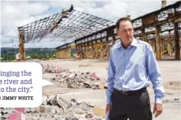  ?? STAFF PHOTO BY TROY STOLT ?? Jimmy White, one of the owners of The Bend, stands in front of the steel framing of one of the large manufactur­ing facilities at the Riverfront Parkway site. White’s mixeduse plans for the 121-acre tract call a place where people and live, work and play.