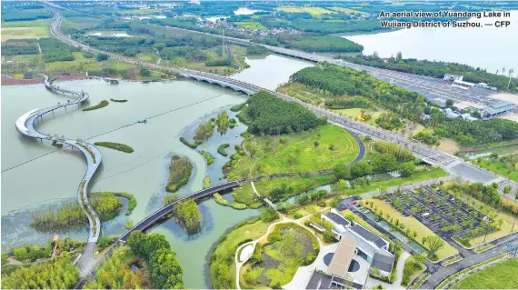  ?? ?? An aerial view of Yuandang Lake in Wujiang District of Suzhou. — CFP