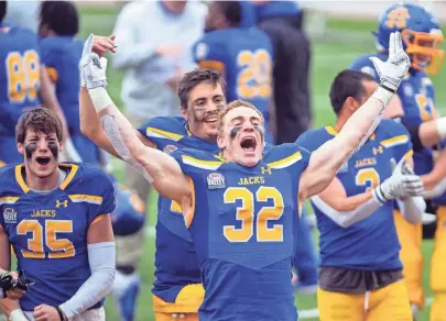  ?? ERIN BORMETT / ARGUS LEADER ?? South Dakota State's Adam Bock yells in victory after the team's win in the FCS semifinals against Delaware on Saturday, May 8, 2021 at Dana J. Dykhouse stadium in Brookings.